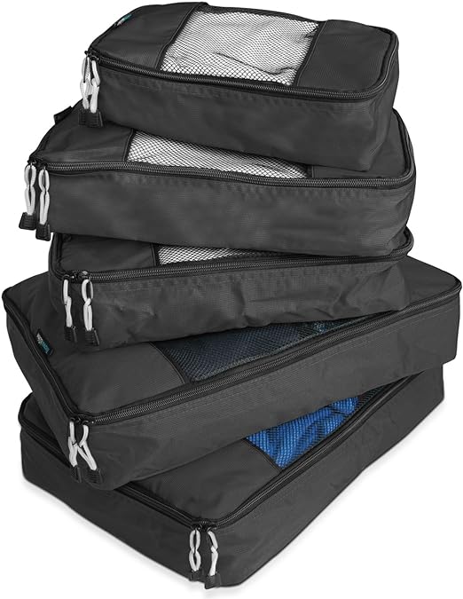 Five black packing cubes stacked up. 