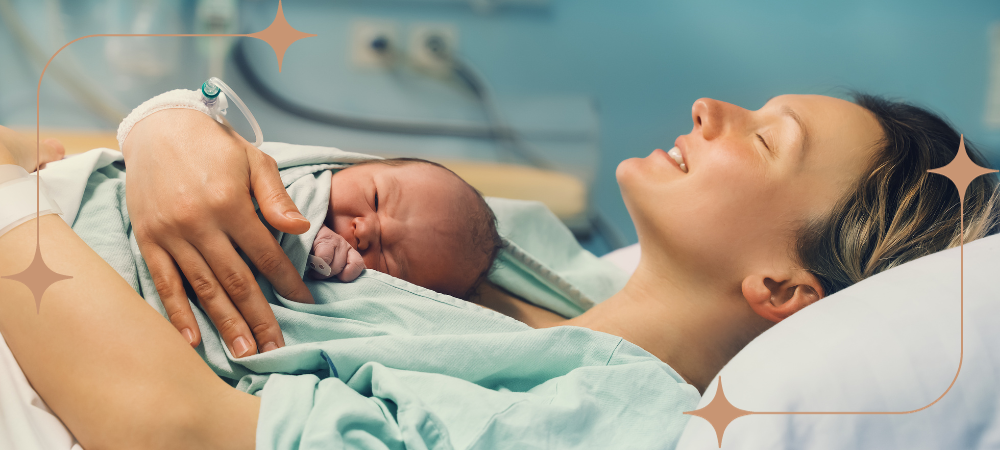 Woman holding newborn baby skin to skin. 